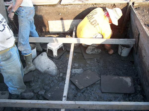 Three or four people are assigned to dig in a single 8’ x 8’ pit.